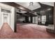 Spacious living room with wood beamed ceilings and large windows offering natural light at 5365 W Princeton Dr, Denver, CO 80235