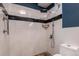 Modern bathroom with white subway tile, stone flooring, and rain shower at 705 S Alton Way # 6B, Denver, CO 80247