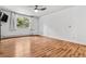 Bright bedroom features hardwood floors, a window with a view and ample space at 705 S Alton Way # 6B, Denver, CO 80247