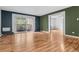 Open floor plan featuring living room, balcony access, and hardwood floors at 705 S Alton Way # 6B, Denver, CO 80247