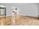 Inviting living room with gleaming hardwood floors and an open view of the modern kitchen at 705 S Alton Way # 6B, Denver, CO 80247