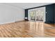 Spacious living room features hardwood floors and sliding glass doors to balcony at 705 S Alton Way # 6B, Denver, CO 80247