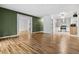 Open concept living room showcasing hardwood floors and seamless flow into updated kitchen at 705 S Alton Way # 6B, Denver, CO 80247