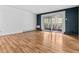 Spacious living room features hardwood floors and sliding glass doors to balcony at 705 S Alton Way # 6B, Denver, CO 80247