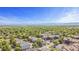 Scenic aerial view of the neighborhood with lush greenery, mountains in the distance, and clear blue skies at 10784 W 63Rd Pl # 205, Arvada, CO 80004