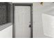 Apartment entrance with a white door and the apartment number at 10784 W 63Rd Pl # 205, Arvada, CO 80004