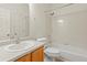 Bathroom featuring a tub with shower, a white sink, and a light wood vanity at 10784 W 63Rd Pl # 205, Arvada, CO 80004