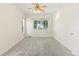 Comfortable bedroom with a ceiling fan and a large window providing ample natural light at 10784 W 63Rd Pl # 205, Arvada, CO 80004