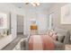Comfortable bedroom with soft carpet, a full bed, and view of a bathroom nearby at 10784 W 63Rd Pl # 205, Arvada, CO 80004