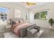 Inviting bedroom with natural light, soft carpet, and a comfortable bed with throw pillows at 10784 W 63Rd Pl # 205, Arvada, CO 80004