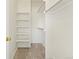 Walk in closet with carpet and white shelving units installed at 10784 W 63Rd Pl # 205, Arvada, CO 80004
