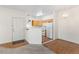 Inviting entryway with hardwood floors leading into the dining area and kitchen, filled with natural light at 10784 W 63Rd Pl # 205, Arvada, CO 80004