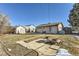 Spacious backyard with a cement patio, shed, and plenty of room for outdoor activities and entertaining at 841 N Oakland St, Aurora, CO 80010