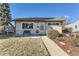 Charming single-story home with a well-maintained front yard and walkway leading to the front door at 841 N Oakland St, Aurora, CO 80010
