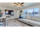 Cozy living room featuring a plush sofa, large window, and mounted TV for ultimate comfort and entertainment at 841 N Oakland St, Aurora, CO 80010