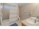 Inviting bathroom featuring double sinks, tub-shower combo, and decorative mirror and fixtures at 9530 Gray St, Westminster, CO 80031
