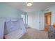 Comfortable bedroom featuring a play tent, neutral carpet, and large closet at 9530 Gray St, Westminster, CO 80031