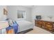 Bright bedroom features a comfortable bed, dresser, and window for natural light at 9530 Gray St, Westminster, CO 80031
