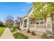 Inviting home boasts a charming front porch with classic white railings and sturdy column supports at 9530 Gray St, Westminster, CO 80031