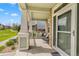 This charming front porch has rocking chairs and a view of the manicured front lawn at 9530 Gray St, Westminster, CO 80031