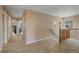 Bright hallway with carpet and a staircase leading to another level of the home at 9530 Gray St, Westminster, CO 80031