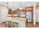 This kitchen features stainless steel appliances, granite countertops, and a beautiful island at 9530 Gray St, Westminster, CO 80031