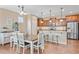 Eat-in kitchen with stainless steel appliances and a kitchen island with barstool seating at 9530 Gray St, Westminster, CO 80031