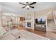 This open-concept living area has a fireplace and flows into the dining area and kitchen at 9530 Gray St, Westminster, CO 80031