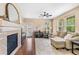 Inviting living room with cozy fireplace, plush seating, and abundant natural light at 9530 Gray St, Westminster, CO 80031