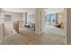 Upstairs loft area with a comfortable seating nook, natural light, and a glimpse into another room at 9530 Gray St, Westminster, CO 80031