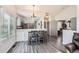 Dining area with seating for two and hardwood floors at 10510 W Fair Ave # A, Littleton, CO 80127