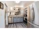 Modern kitchen featuring stainless steel appliances and an open layout at 10510 W Fair Ave # A, Littleton, CO 80127
