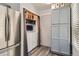 Convenient laundry area with washer and dryer, next to stainless steel refrigerator at 10510 W Fair Ave # A, Littleton, CO 80127