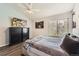 Comfortable main bedroom with soft lighting and a large window at 10510 W Fair Ave # A, Littleton, CO 80127