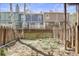 Fenced backyard with mature trees and lawn is ready for relaxing and entertaining at 12031 E Ford Cir, Aurora, CO 80012