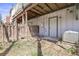 Enclosed backyard area with wooden fencing and a white exterior door for convenient access at 12031 E Ford Cir, Aurora, CO 80012