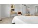Spacious bedroom featuring a comfortable bed, modern decor, and convenient access to an ensuite bathroom at 12031 E Ford Cir, Aurora, CO 80012