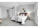 Well-lit bedroom offering a comfortable bed, stylish decor, and ample space for rest and relaxation at 12031 E Ford Cir, Aurora, CO 80012
