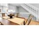 Dining area flows into a modern kitchen with a breakfast bar and white cabinetry at 12031 E Ford Cir, Aurora, CO 80012