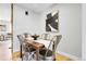 Dining area features modern decor, neutral paint and beautiful hardwood floors at 12031 E Ford Cir, Aurora, CO 80012