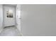Entryway featuring neutral paint, tile floors, a coat closet, and a door to the outside at 12031 E Ford Cir, Aurora, CO 80012