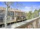 Backyard deck with view of townhomes and lush landscaping at 12031 E Ford Cir, Aurora, CO 80012