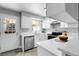 Bright kitchen features quartz countertops, stainless steel appliances, and a door leading to the outside at 12031 E Ford Cir, Aurora, CO 80012
