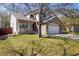 Attractive home with a stone-accented facade, covered porch, two-car garage, and lovely curb appeal at 4565 Pussywillow Ct, Boulder, CO 80301