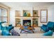 Stylish living room highlighting a cozy fireplace, built-in shelving, and comfortable seating arrangements at 4565 Pussywillow Ct, Boulder, CO 80301