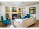 Bright living room features a fireplace, built-in shelves, and comfortable seating arrangements at 4565 Pussywillow Ct, Boulder, CO 80301