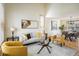 Cozy living room with bright, neutral decor, with a modern glass table, and an open layout with a dining space at 4565 Pussywillow Ct, Boulder, CO 80301