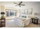 Spacious bedroom featuring a large window with natural light and a ceiling fan at 4565 Pussywillow Ct, Boulder, CO 80301