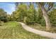 Scenic walking path surrounded by lush greenery and trees, perfect for outdoor recreation at 4565 Pussywillow Ct, Boulder, CO 80301