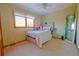 Bright bedroom with a bed, mirror, and ample natural light at 11052 Zephyr St, Broomfield, CO 80021